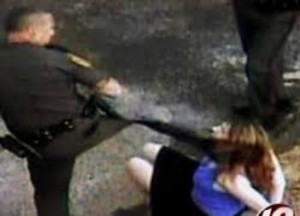 Cop Kicks Woman