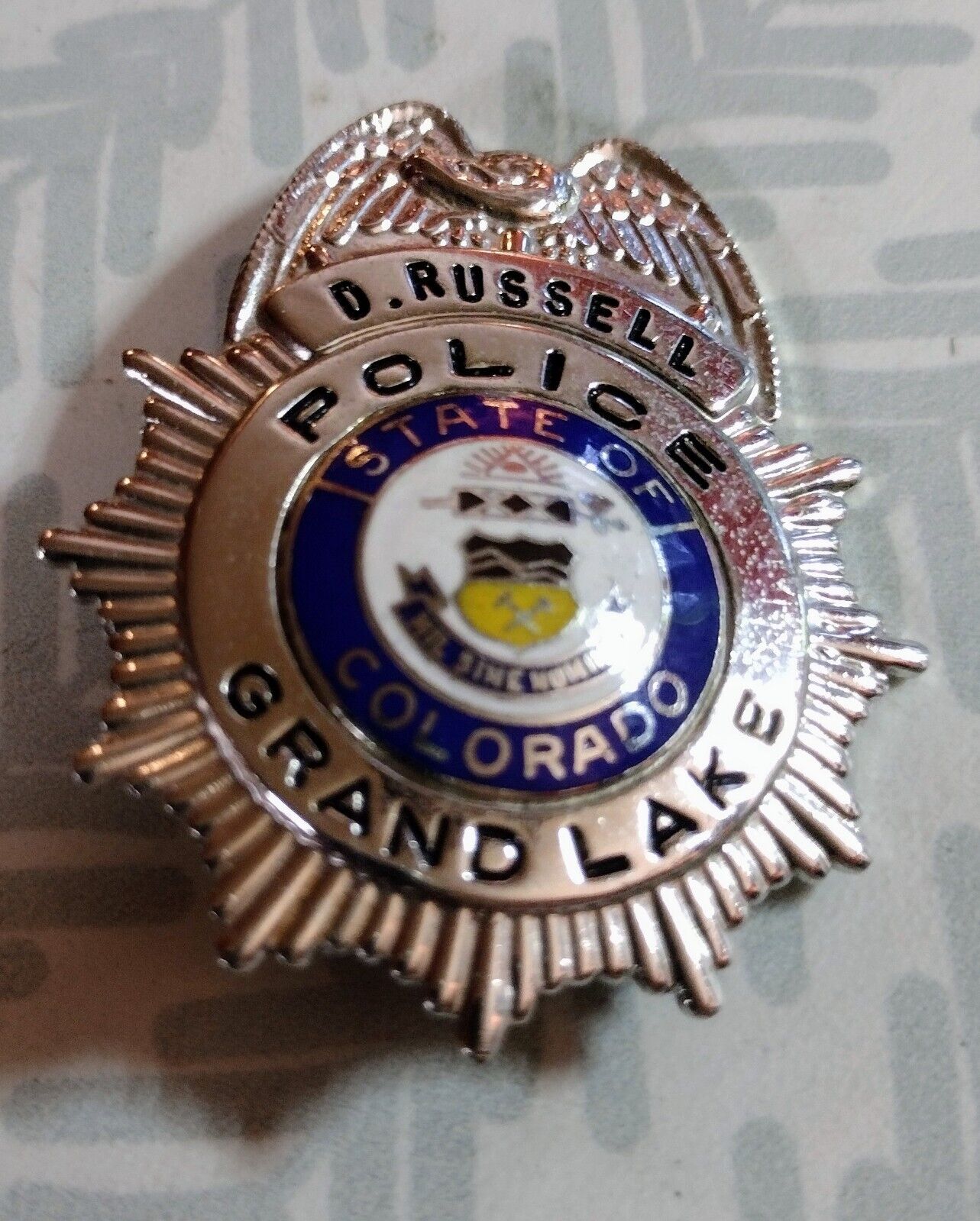 GRAND LAKE COLORADO POLICE BADGE NAMED D. RUSSELL