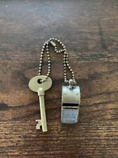 antique police whistle and call box key picture
