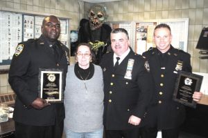 Officer Richard Phipps (left), receiving the "Cop of the Month" award.